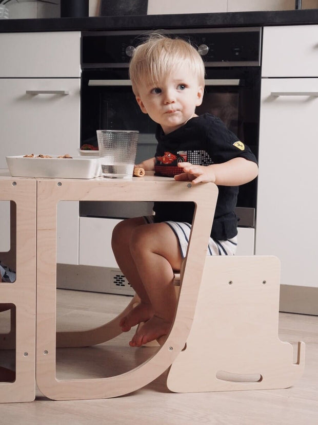 Versatile 3-in-1 highchair and step stool for toddlers.