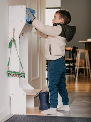 Kids' coat rack with storage cubbies