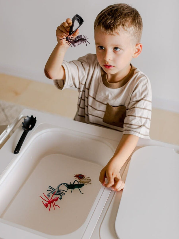 Wooden sensory table for toddlers.