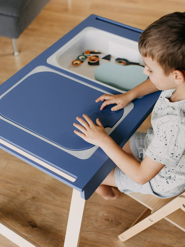 Blue sensory table for toddlers.