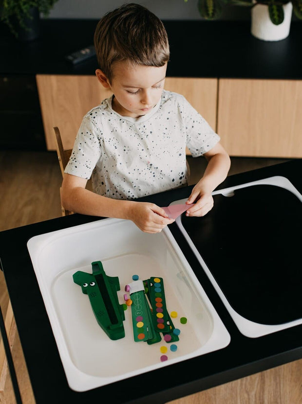 Minimalist wooden sensory table design.