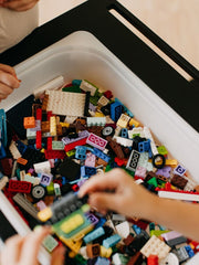 Wooden sensory activity table for toddlers.