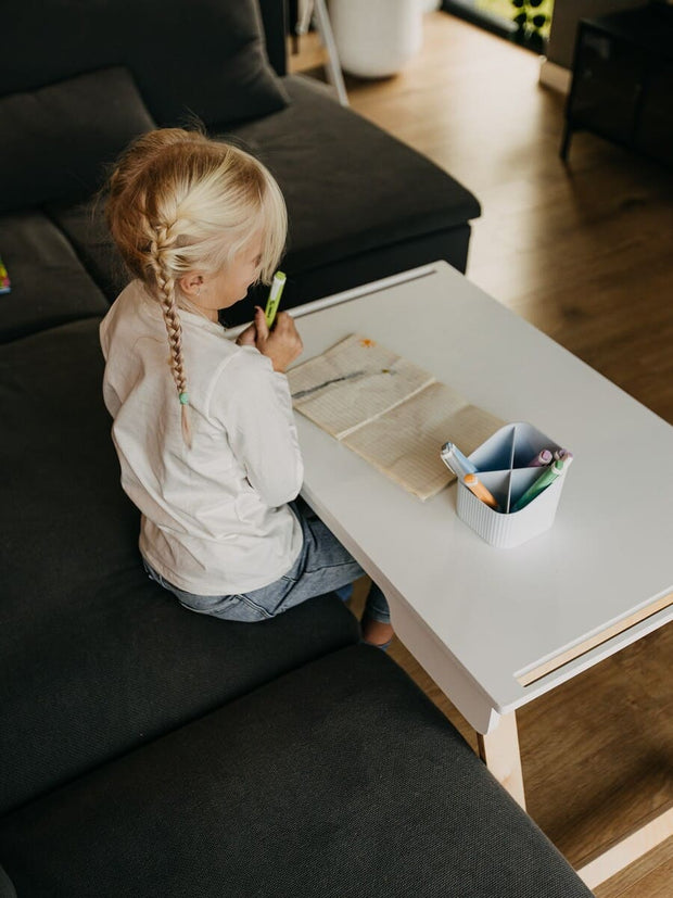 Child-friendly wooden sensory activity table.