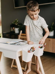 Wooden sensory table for exploration.