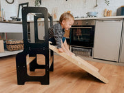 Space-saving, adjustable toddler helper stool for home kitchens.