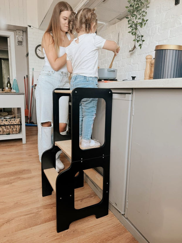 Eco-friendly wooden toddler tower with modern, minimalist aesthetics.