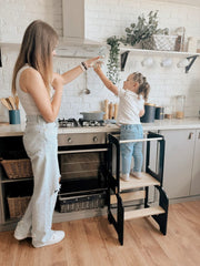 Toddler step stool with guardrails for safety and stability.