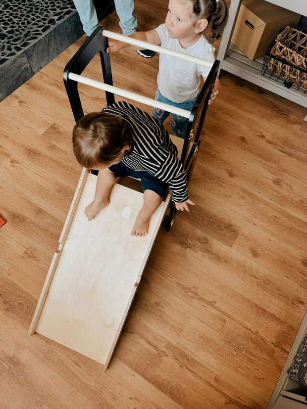 Portable and foldable learning tower for small kitchens and play areas.