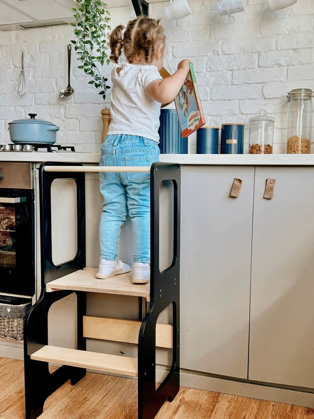 Convertible kitchen helper stool for toddlers with dual-step design.