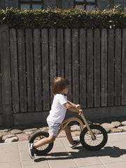 Handcrafted children's balance bike with add-ons