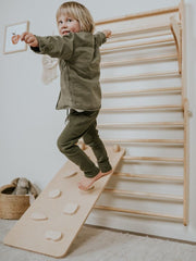 Kids' climbing structure with Swedish wall