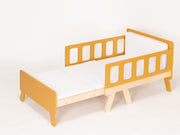 Expandable children's bed with modular mattress