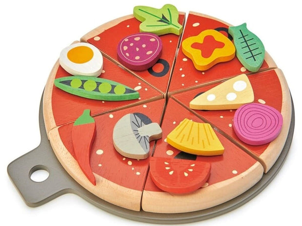 Wooden pizza slices with toppings