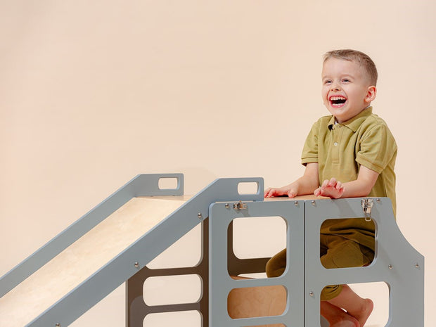 Convertible learning tower with safety slide attachment