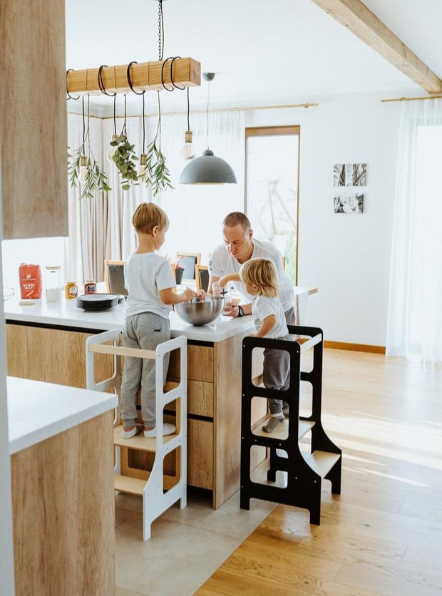 Learning Tower with Father and Children in Kitchen